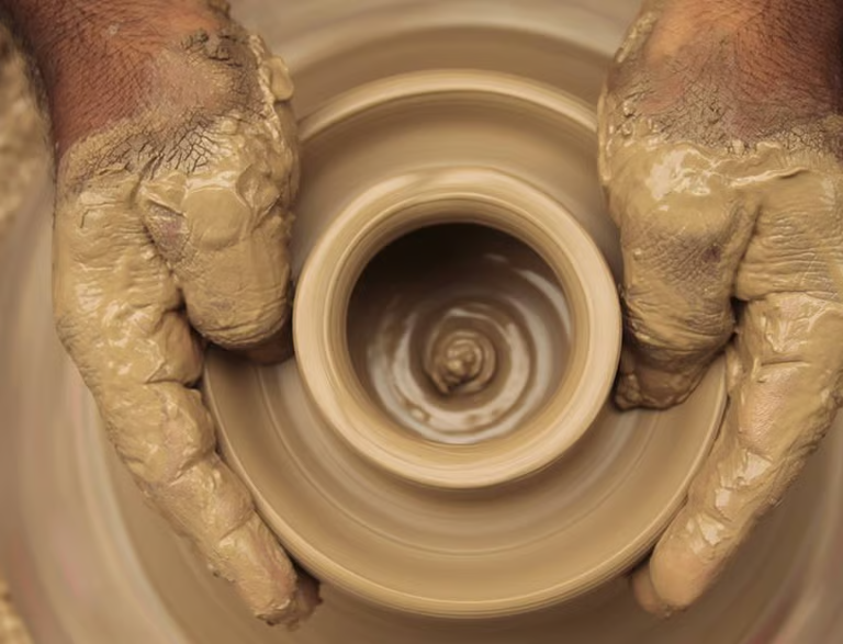 Teacher crafting pottery